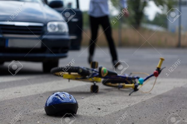30135867-horizontal-view-of-car-driver-hitting-little-biker-stock-photo