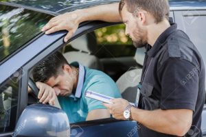 49426211-sad-young-man-in-car-fined-by-police-officer-stock-photo-police-traffic-ticket